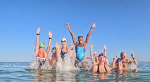 Splash and Dash swim event by Naples Area Triathletes show swimmers in the water.